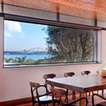 A dining room table in front of a window