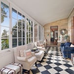 A living room filled with furniture and a large window