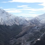 A canyon with a mountain in the background