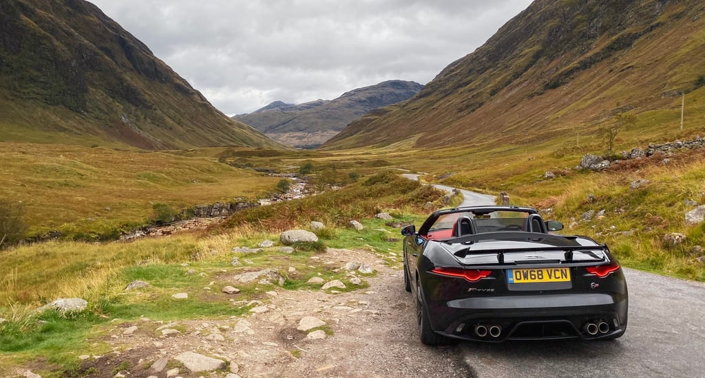 A car parked on the side of a mountain