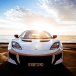 A car parked in front of a body of water