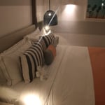 A lamp that is sitting on a bed