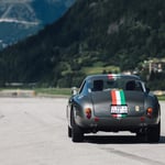 A car driving on a mountain road