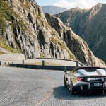 A car parked on the side of a mountain