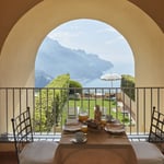 A dining room table in front of a building