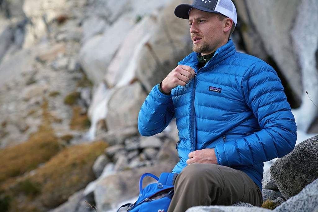 A person sitting on a rock