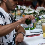 A man cutting food on a table