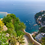 A close up of a hillside next to a body of water