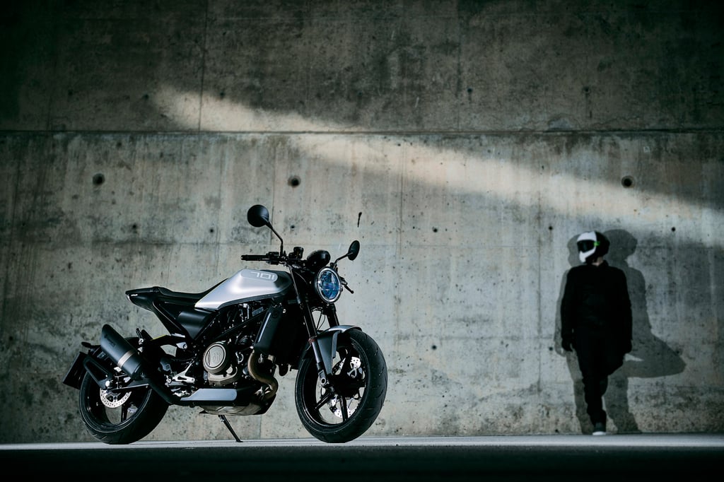 A motorcycle parked on the side of a building