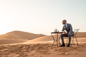 A man sitting at a beach
