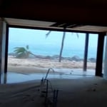 A view of a beach next to the window