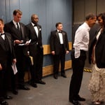 A group of people standing in a room