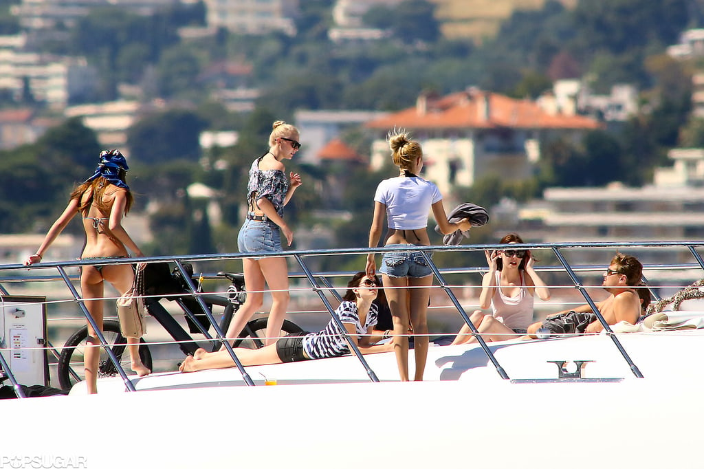 A group of people riding on the back of a boat