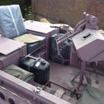 A pile of luggage sitting on top of a building