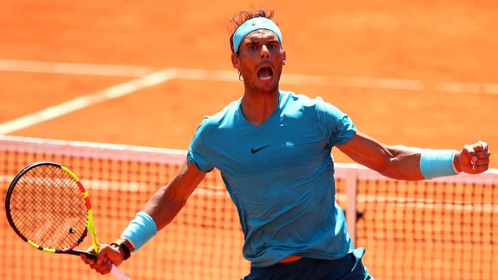 A man holding a racket on a court