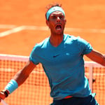 A man holding a racket on a court