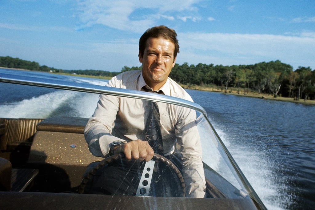 A man in a boat on a body of water