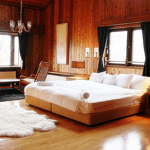 A bedroom with a large bed in a room