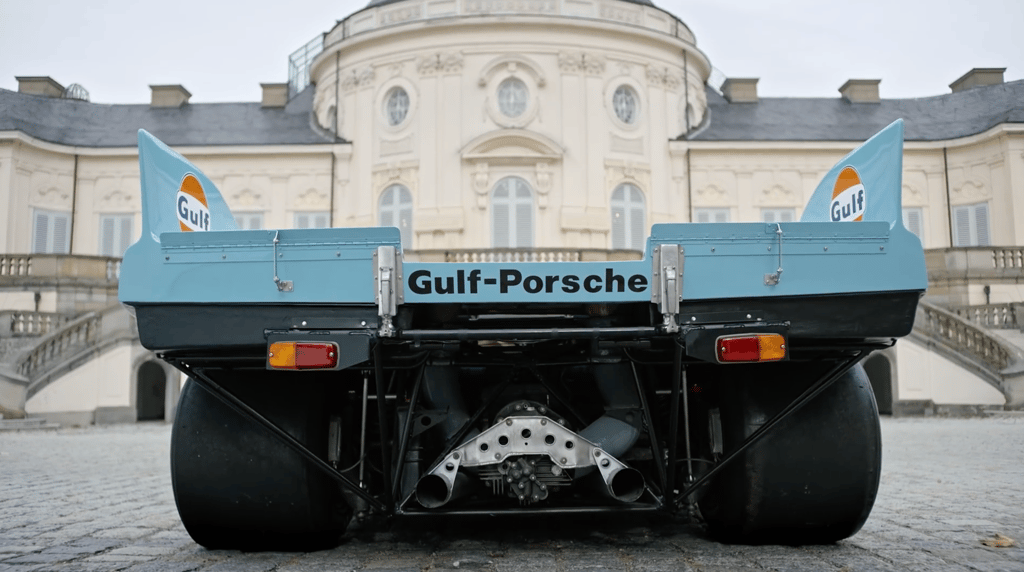 A truck is parked in front of a building