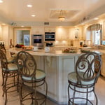 A kitchen with an island in the middle of a room