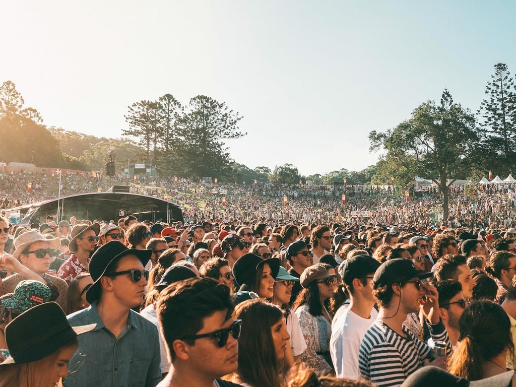 A group of people standing in front of a crowd