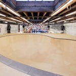 A man riding a skateboard up the side of a ramp