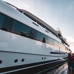 A train is parked on the side of a boat