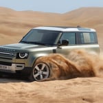 A car parked on a dirt road