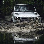 A car driving down a dirt road