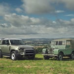 A truck is parked in a grassy field