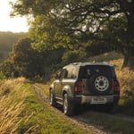 A car driving down a dirt road