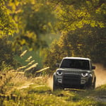 A truck driving down a dirt road