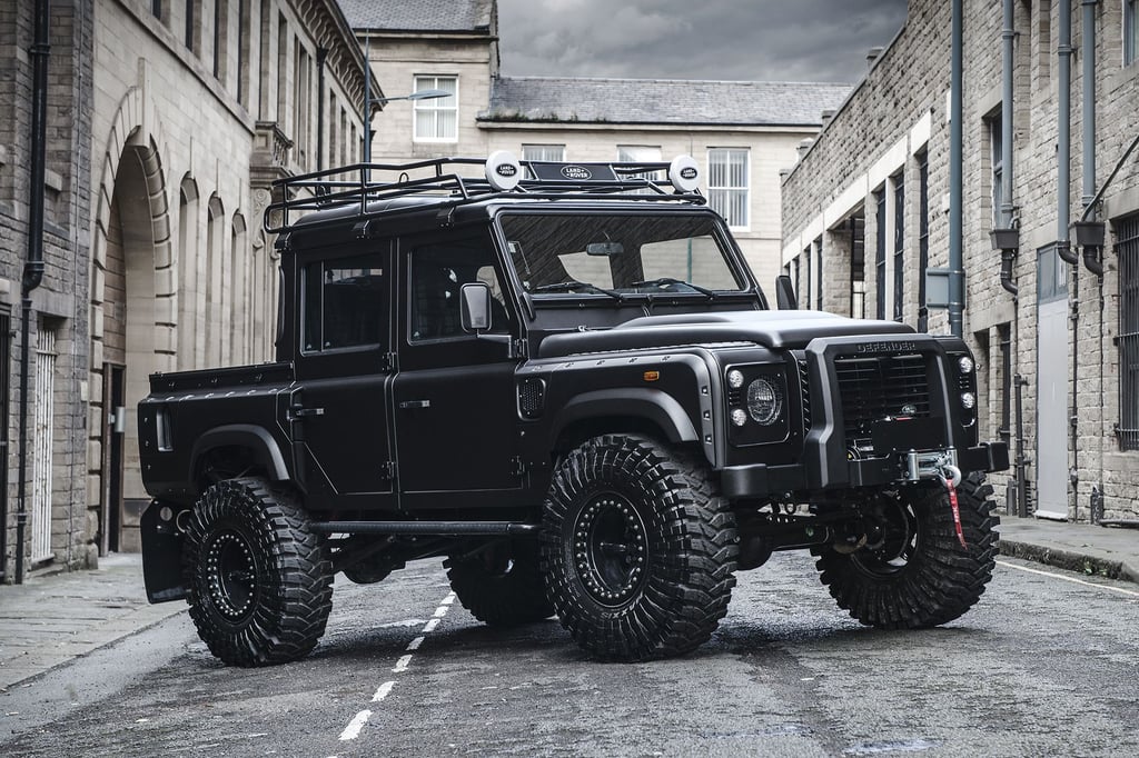 A truck is parked in front of a building