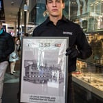 A person standing in front of a store