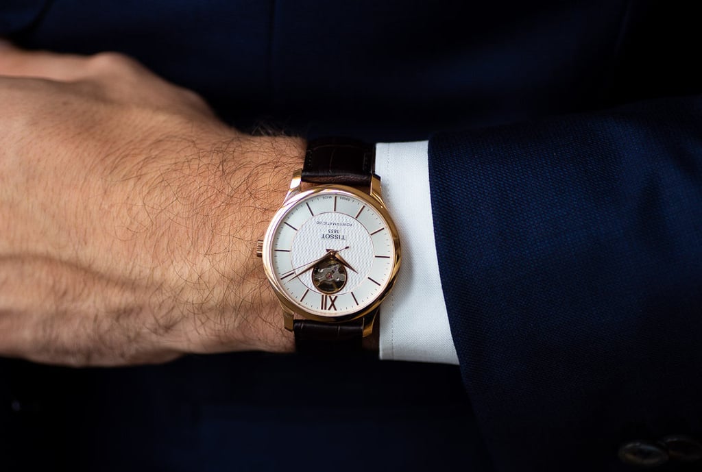 A close up of a clock in the middle of a watch