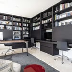 A flat screen tv sitting on top of a book shelf