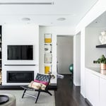 A view of a living room filled with furniture and a fireplace