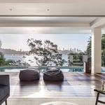 A living room filled with furniture and a large window