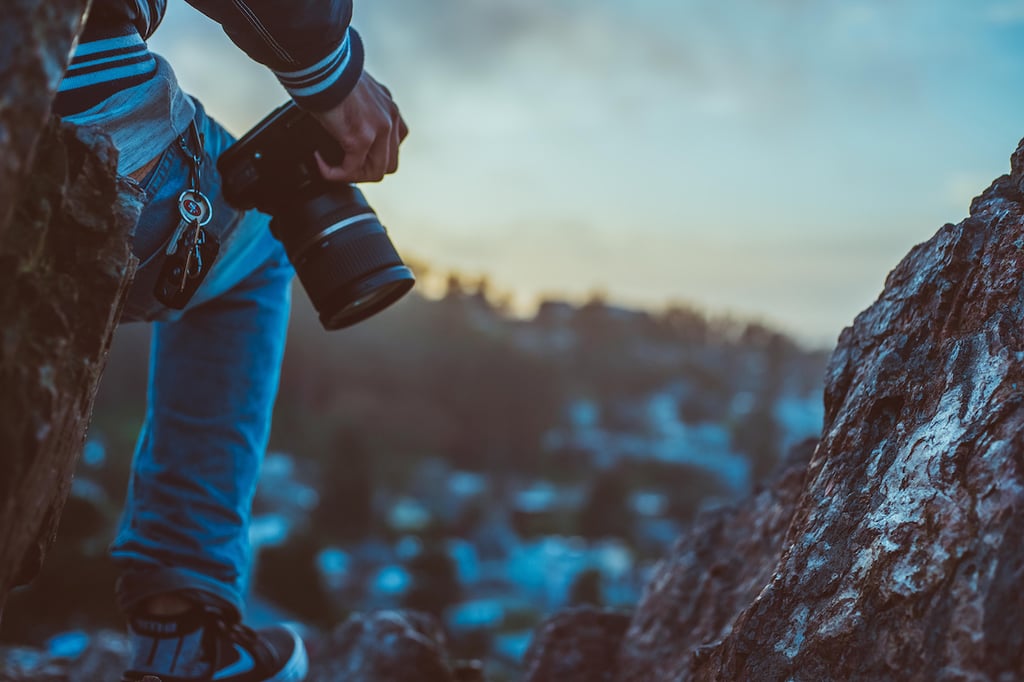 A person standing on top of a mountain