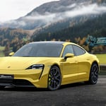 A car parked in front of a mountain