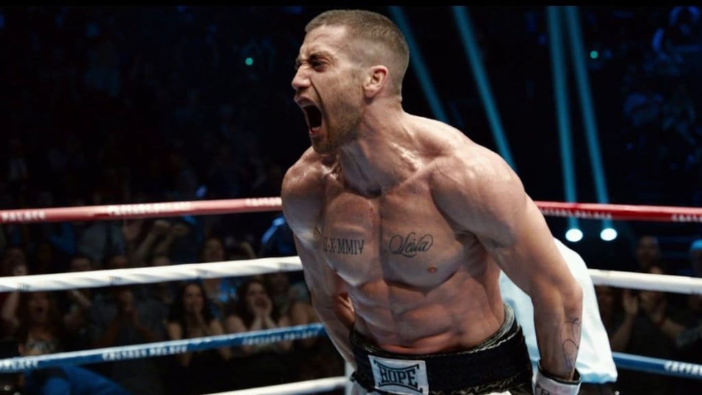 A man standing in front of a boxing ring