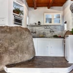 A stove top oven sitting inside of a kitchen