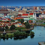 A large body of water with a city in the background