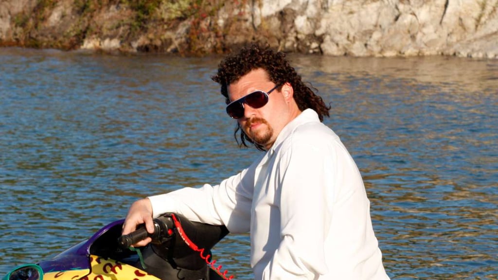 A man standing next to a body of water