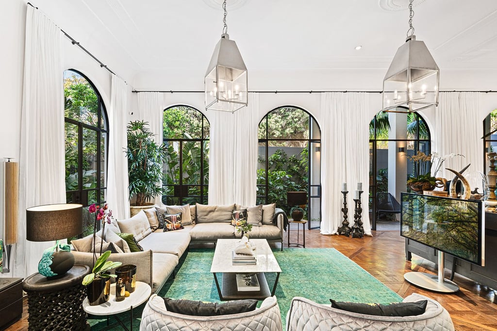 A living room filled with furniture and a large window