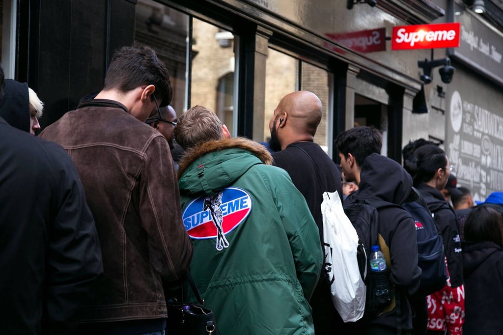 A group of people standing in front of a crowd