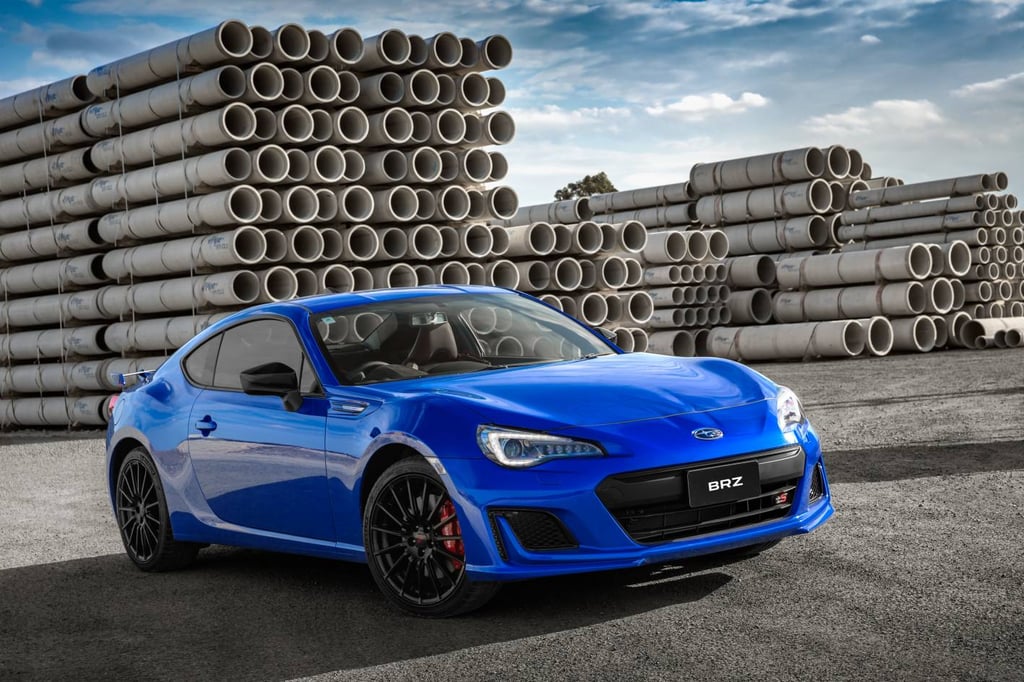 A blue car parked in front of a building