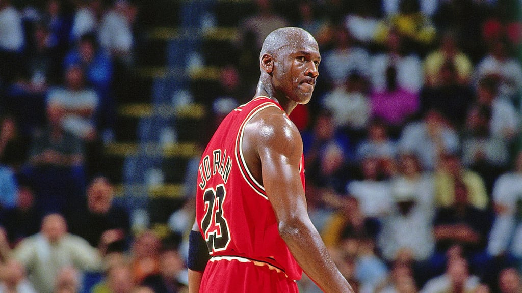 A basketball player in front of a crowd