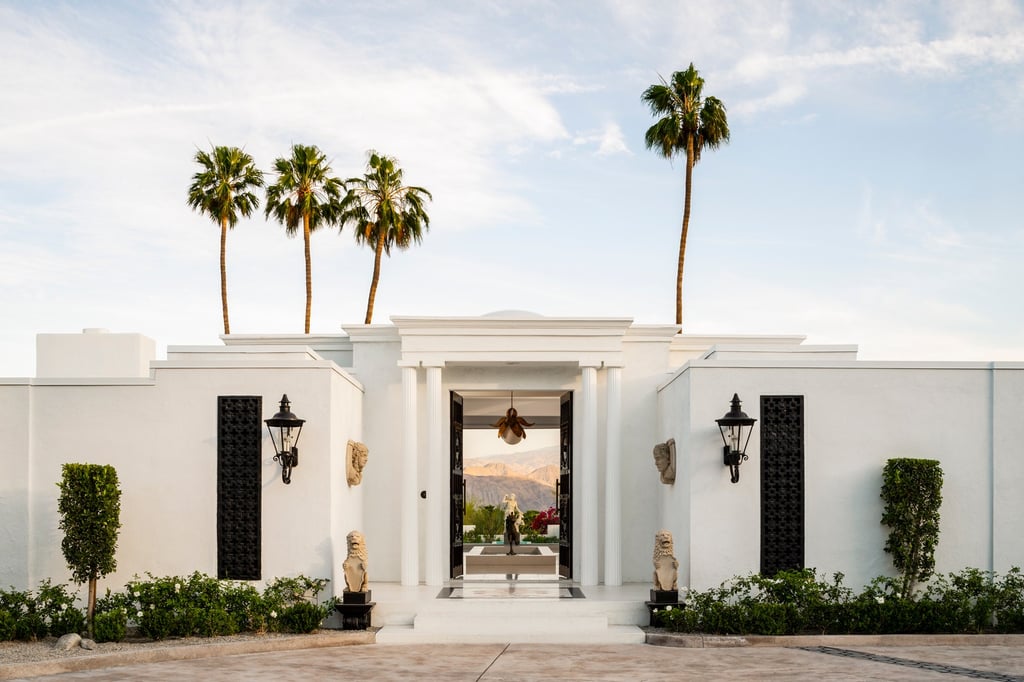 A large building with palm trees