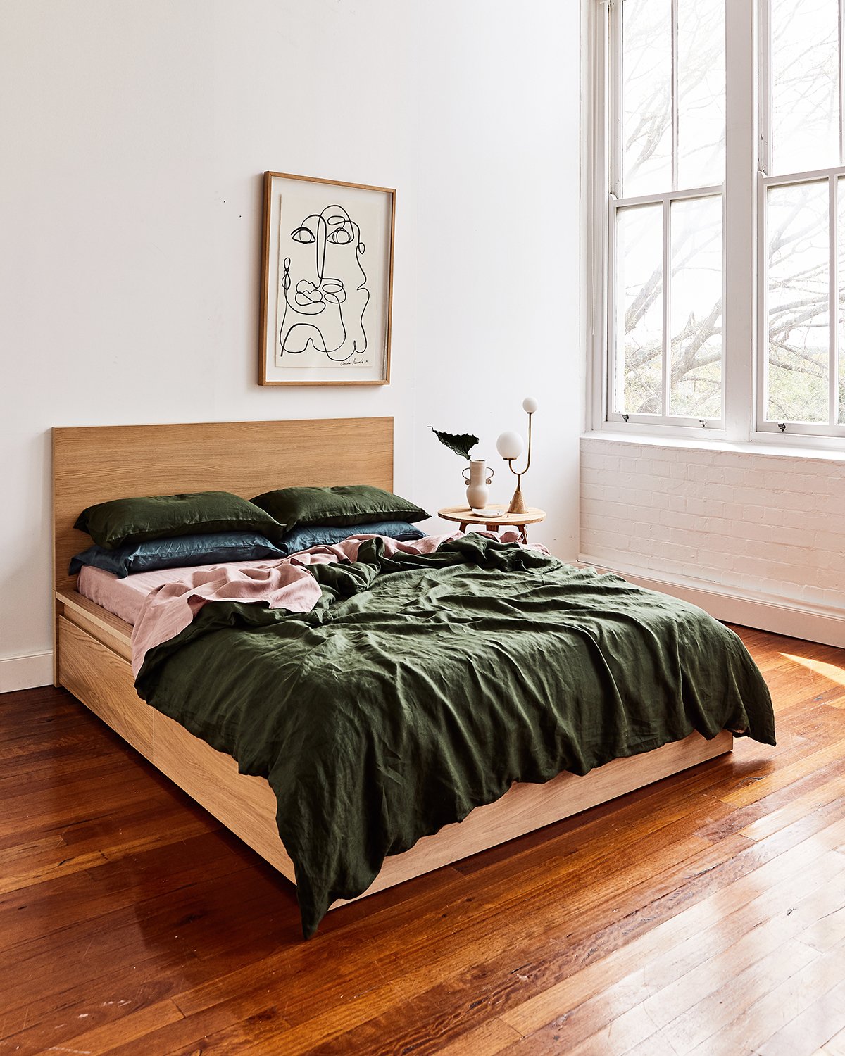 A bedroom with a large bed sitting in a room